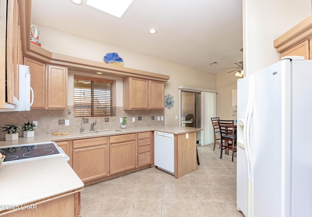 2554 Beverly Glen Dr, Lake Havasu City, AZ 86403 - kitchen featuring white appliances, light brown cabinets, decorative backsplash, a peninsula, and a sink
