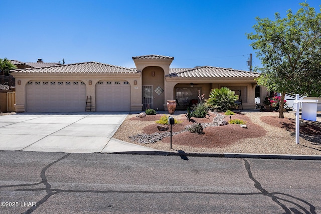 2554 Beverly Glen Dr, Lake Havasu City, AZ 86403 - view of front of house with stucco siding, a garage, a tile roof, and driveway