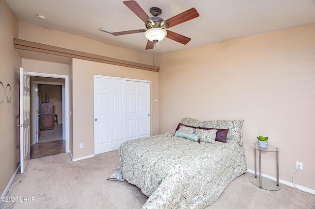 2554 Beverly Glen Dr, Lake Havasu City, AZ 86403 - bedroom featuring light colored carpet, baseboards, a closet, and ceiling fan