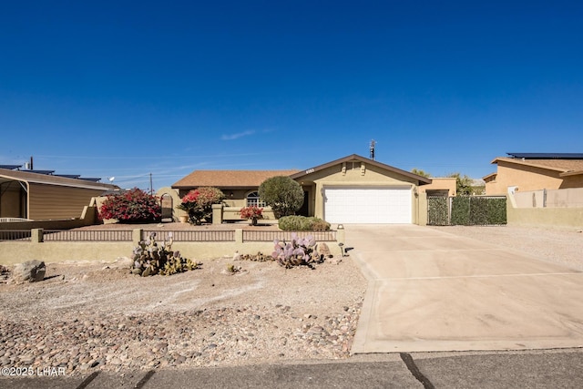 ranch-style house featuring a garage, concrete driveway, fence, and stucco siding