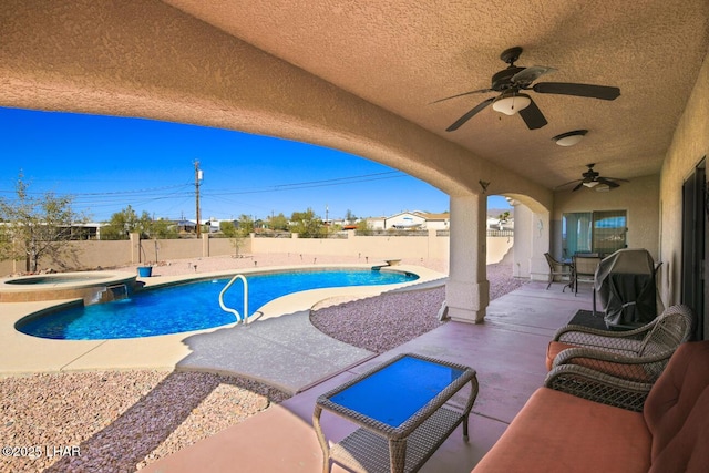 view of pool with a patio, an in ground hot tub, and ceiling fan