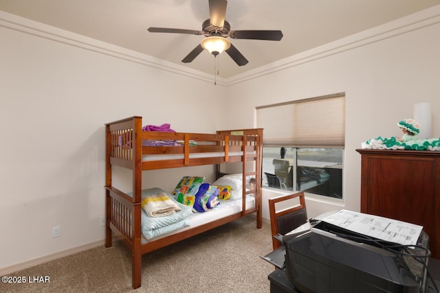 bedroom featuring crown molding, carpet flooring, and ceiling fan