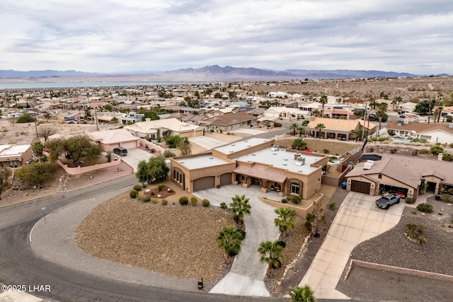 birds eye view of property with a mountain view and a residential view