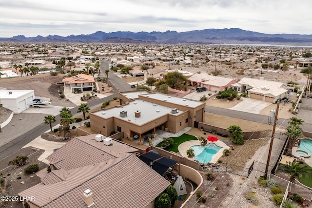 drone / aerial view featuring a residential view and a mountain view