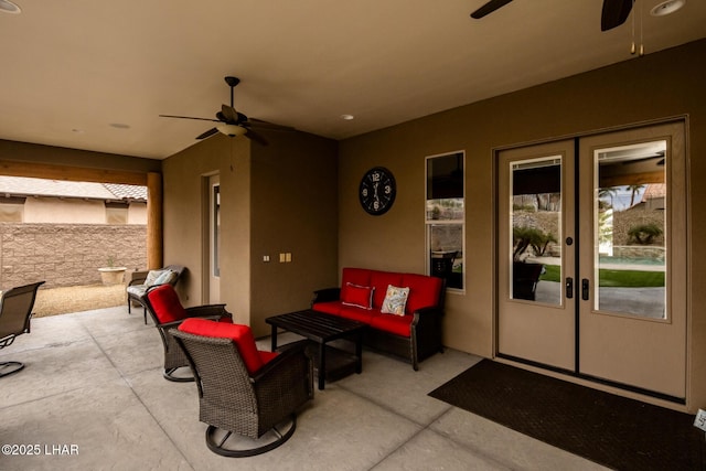 view of patio featuring french doors, outdoor lounge area, and a ceiling fan