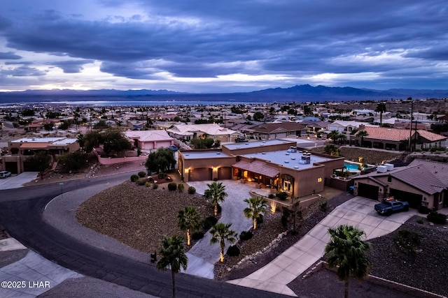 birds eye view of property with a residential view and a mountain view