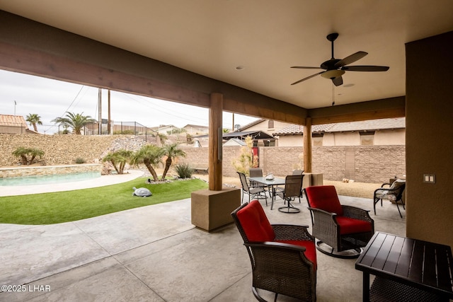 view of patio / terrace featuring ceiling fan, a fenced backyard, and outdoor dining area