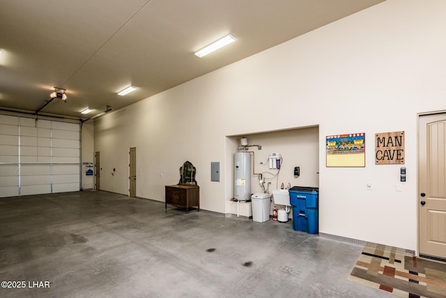 garage featuring water heater and electric panel