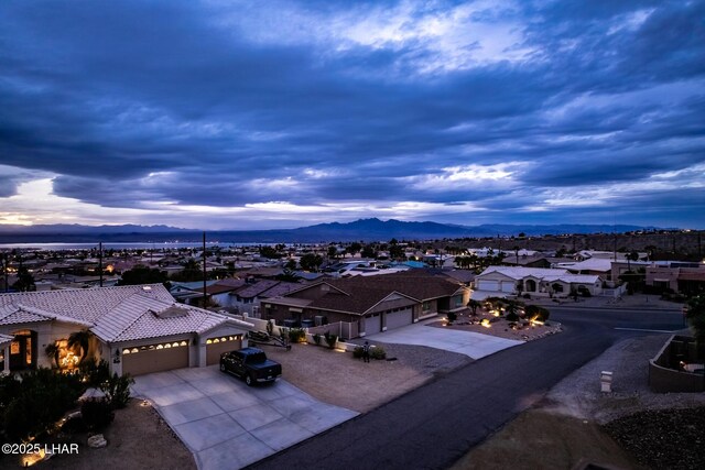 drone / aerial view featuring a mountain view and a residential view