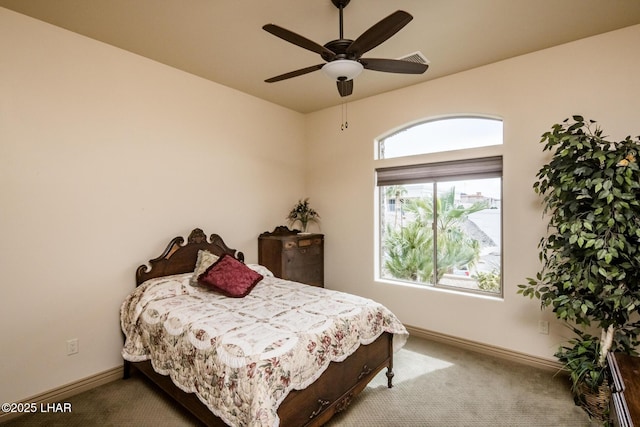 bedroom with carpet, visible vents, ceiling fan, and baseboards