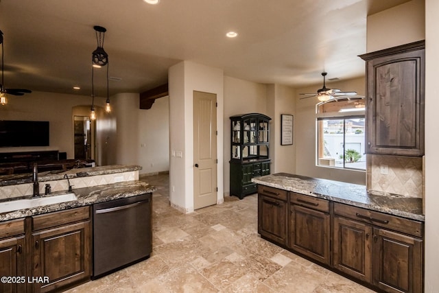 kitchen with tasteful backsplash, dishwasher, ceiling fan, dark brown cabinets, and a sink