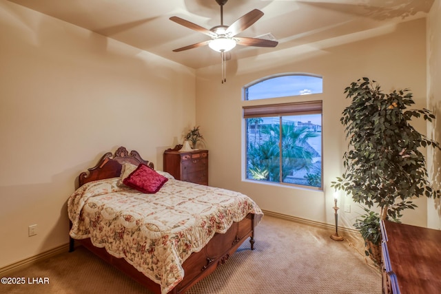 bedroom featuring a ceiling fan, baseboards, and carpet flooring