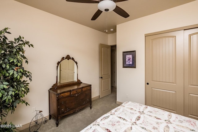 carpeted bedroom featuring ceiling fan, baseboards, and a closet