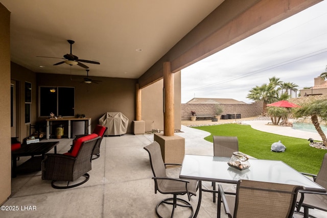 view of patio featuring outdoor dining space and ceiling fan