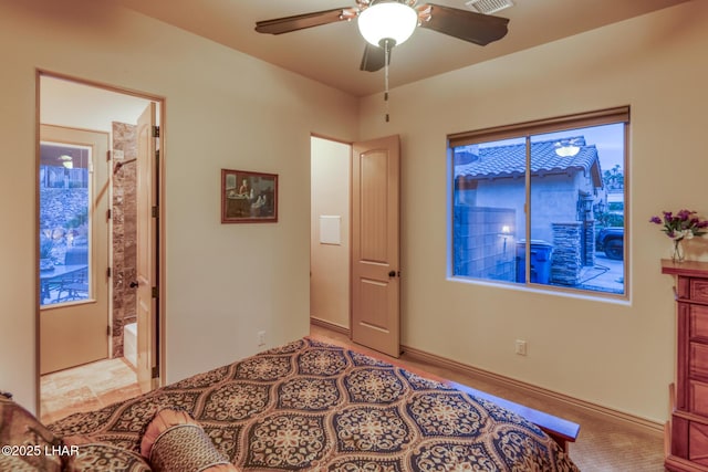 bedroom with ceiling fan, ensuite bath, and visible vents