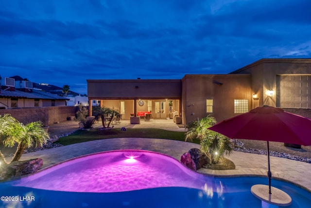 view of swimming pool with a patio area, a hot tub, fence, and a fenced in pool