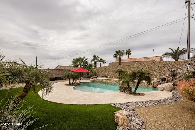 view of swimming pool featuring a fenced in pool, a patio area, and a fenced backyard