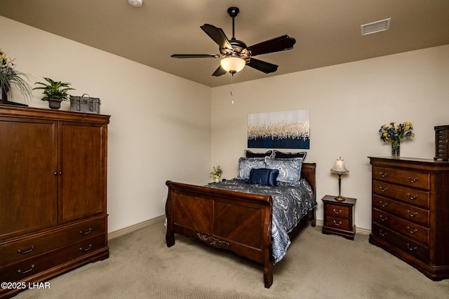 bedroom featuring light colored carpet, visible vents, ceiling fan, and baseboards