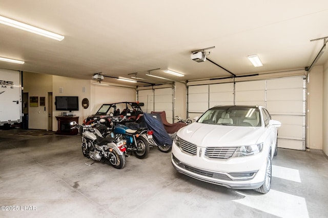 garage featuring a garage door opener