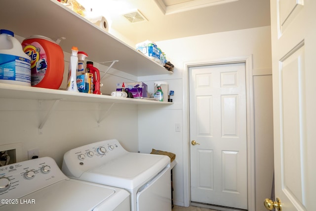 laundry room with washer and dryer, laundry area, and visible vents