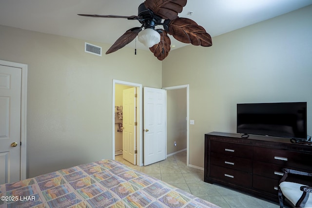 bedroom featuring light tile patterned floors, baseboards, visible vents, and ceiling fan