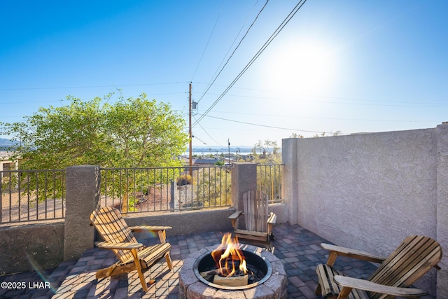 view of patio / terrace featuring an outdoor fire pit