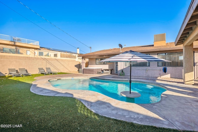view of pool with a fenced in pool, fence, a yard, a patio, and a jacuzzi