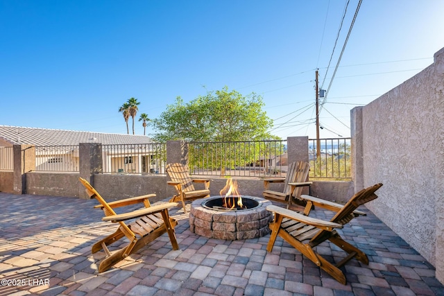 view of patio featuring an outdoor fire pit