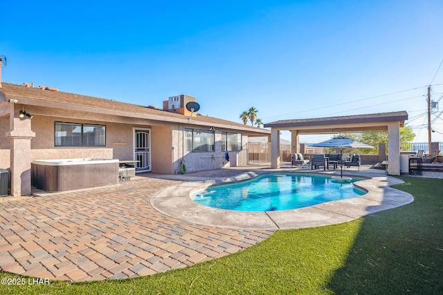 view of pool with a patio area, a fenced in pool, a hot tub, and fence