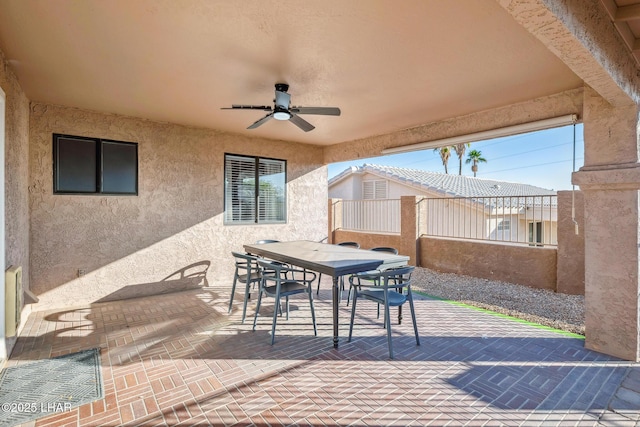 view of patio / terrace with ceiling fan and outdoor dining area