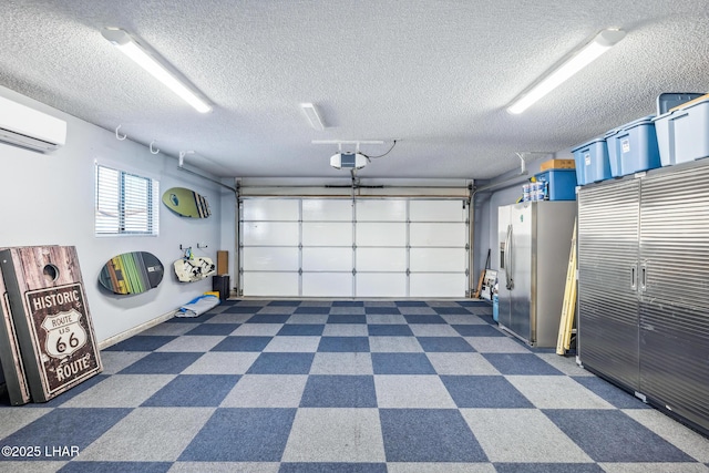 garage with stainless steel refrigerator with ice dispenser, a garage door opener, and a wall mounted AC