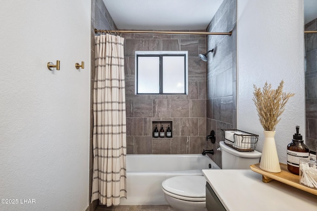 bathroom featuring toilet, a textured wall, vanity, and shower / bath combo with shower curtain
