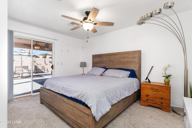 bedroom with access to outside, light colored carpet, and ceiling fan