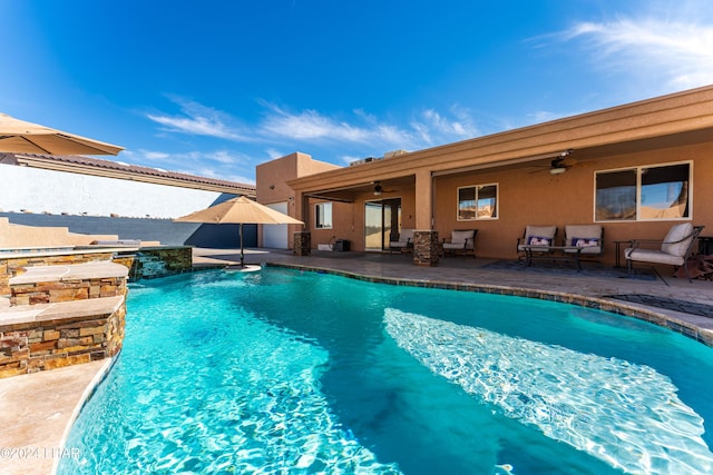 view of swimming pool with an outdoor living space, ceiling fan, a patio, and a fenced in pool