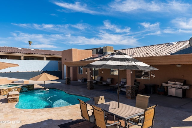 view of pool with a patio, a grill, and an in ground hot tub