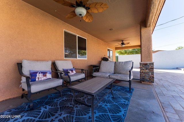 view of patio featuring an outdoor living space and ceiling fan