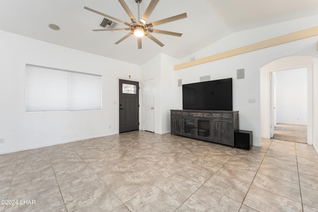 unfurnished living room with ceiling fan and vaulted ceiling