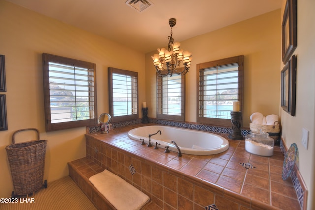 9124 Lakeview Dr, Parker, AZ 85344 - bathroom with a notable chandelier and tiled bath