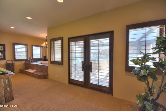 9124 Lakeview Dr, Parker, AZ 85344 - interior space featuring light colored carpet and a notable chandelier