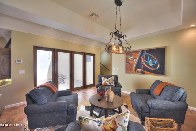 9124 Lakeview Dr, Parker, AZ 85344 - living room featuring french doors, tile patterned floors, and a raised ceiling