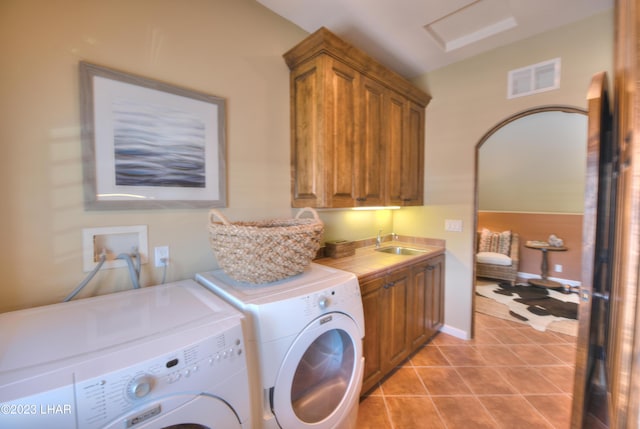9124 Lakeview Dr, Parker, AZ 85344 - laundry room with cabinets, light tile patterned floors, sink, and washing machine and clothes dryer