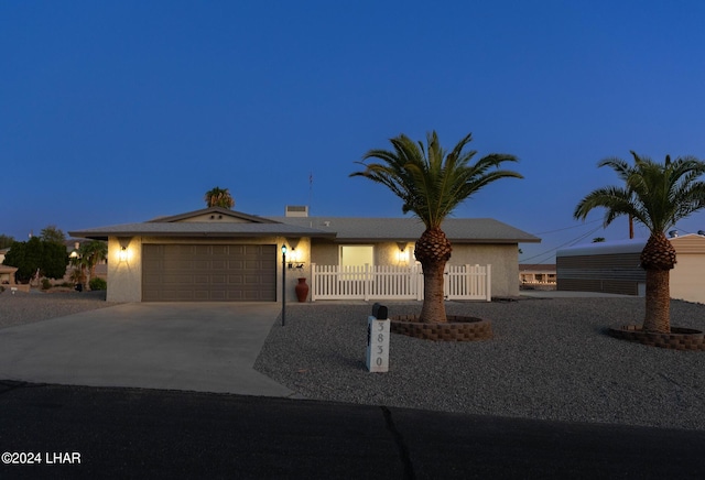 ranch-style house with a carport and a garage