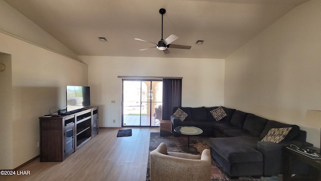 living room with vaulted ceiling, light hardwood / wood-style floors, and ceiling fan