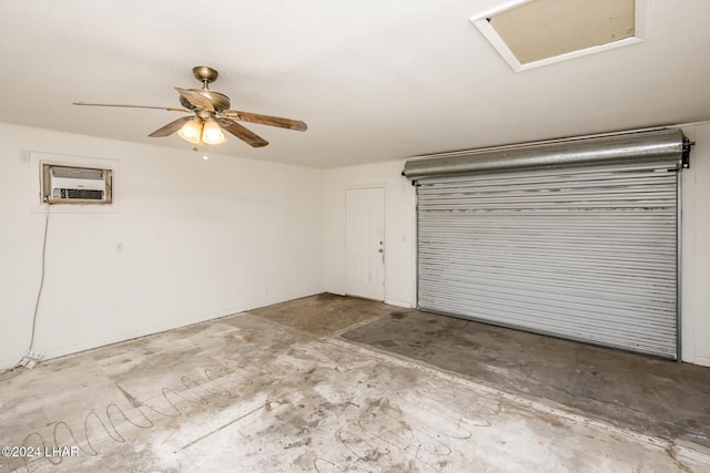 garage with ceiling fan and a wall unit AC