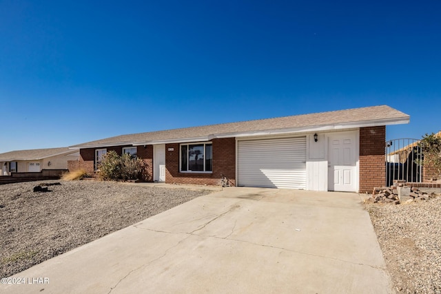 single story home featuring a garage