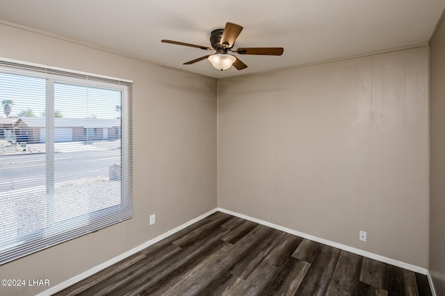unfurnished room with dark hardwood / wood-style flooring and ceiling fan