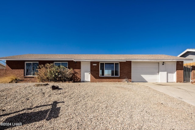 ranch-style home featuring a garage