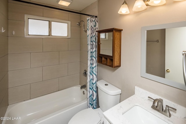 full bathroom featuring vanity, shower / tub combo with curtain, and toilet