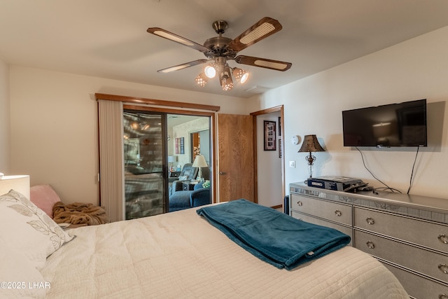 bedroom featuring access to outside and a ceiling fan