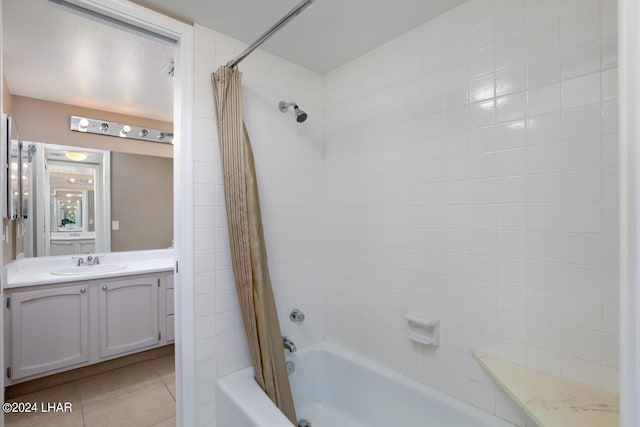 bathroom featuring shower / bath combination with curtain, vanity, and tile patterned flooring